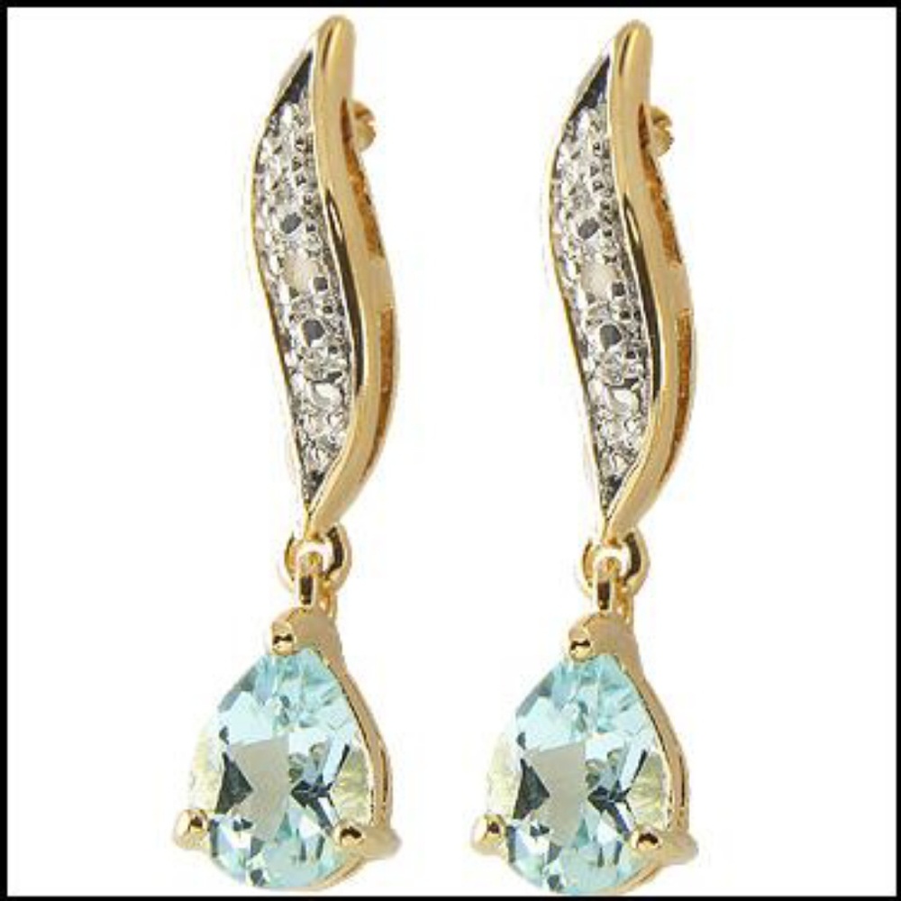 Stunning 18k gold over sterling silver blue topaz